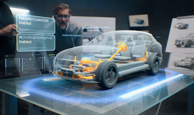 Engineers looking at a futuristic, transparent 3D hologram of a car showcasing AI autopilot control systems.