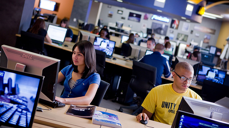 Students in a computer lab looking at computer screens