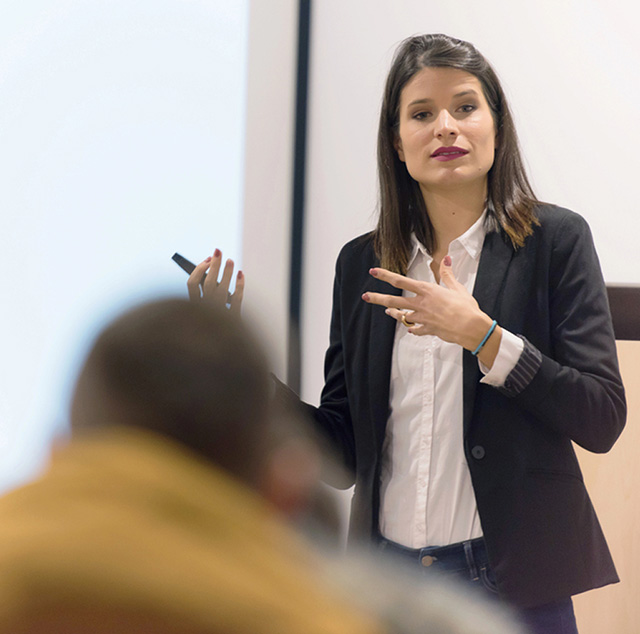 Woman standing in front of a whiteboard