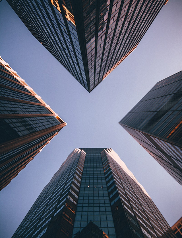 View looking up at four skyscrapers