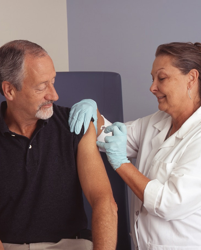 Medical professional preparing to give a patient an injection